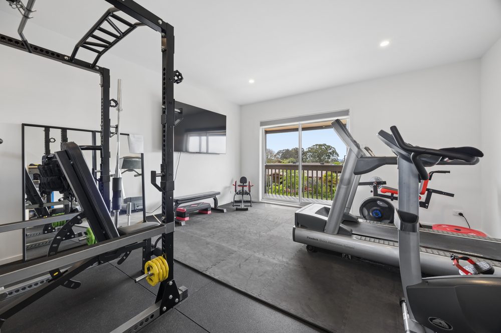 Upstairs room with gym equipment and a view out the window